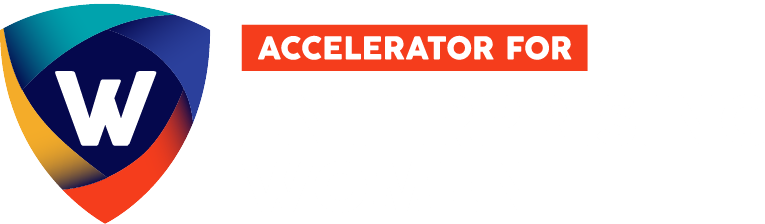A logo featuring a multicolored shield with a stylized white "W" inside it on the left. To the right, there is an orange rectangle with the words "ACCELERATOR FOR" in white text inside. This program supports women in business and those starting a business as entrepreneurs.