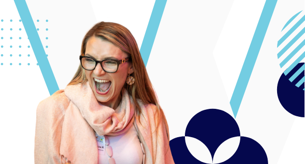 A woman with long hair and glasses is smiling joyfully. She is wearing a light-colored scarf and jacket, embodying the spirit of female businesses. The background features a geometric design with blue and white shapes and patterns.