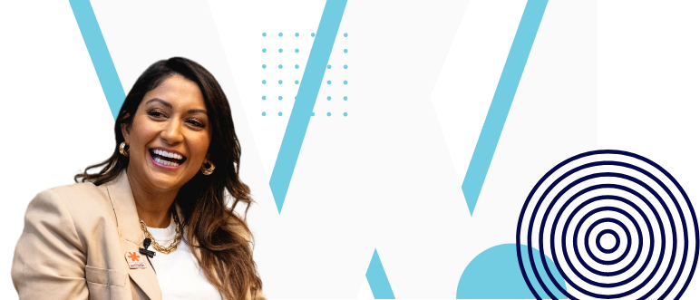 A woman with long hair and a bright smile is wearing a beige blazer over a white top. She stands against a background featuring large blue "W" letters and various graphic elements like dots and circular patterns, embodying the spirit of business ideas for women entrepreneurs starting a business.